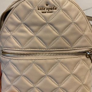 Kate Spade small cream colored quilted backpack